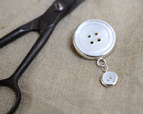 Two button brooch